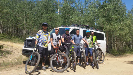 Group of mountain bike riders ready to tackle the South Boundary Trail from Forest road 76.